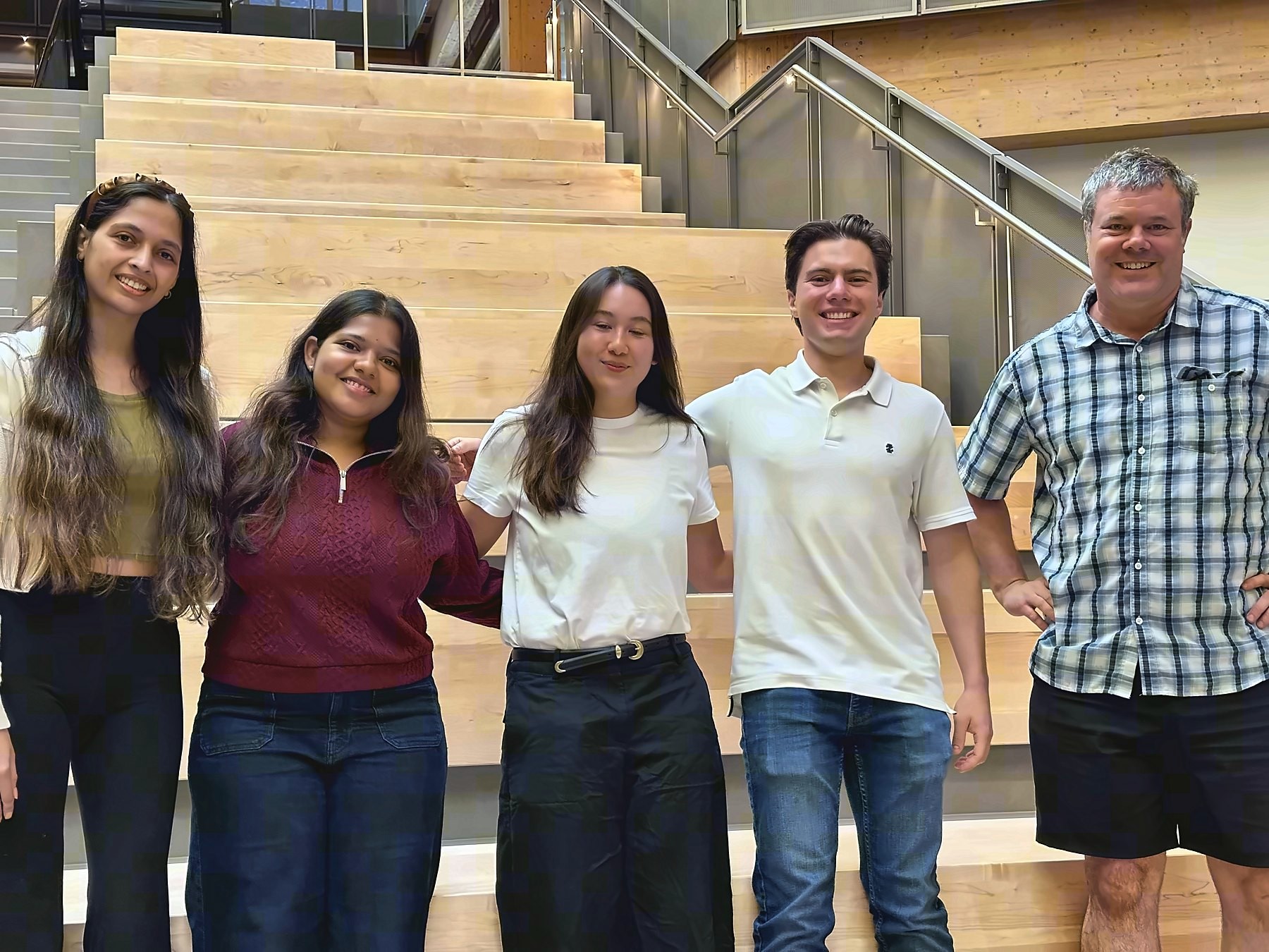 The project team standing together in the atrium